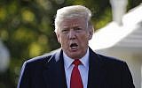 US President Donald Trump stops to talk to the media before walking across the South Lawn of the White House in Washington, October 22, 2018, to board Marine One helicopter for a short trip to Andrews Air Force Base, Maryland., en route to Houston. (AP Photo/Pablo Martinez Monsivais)
