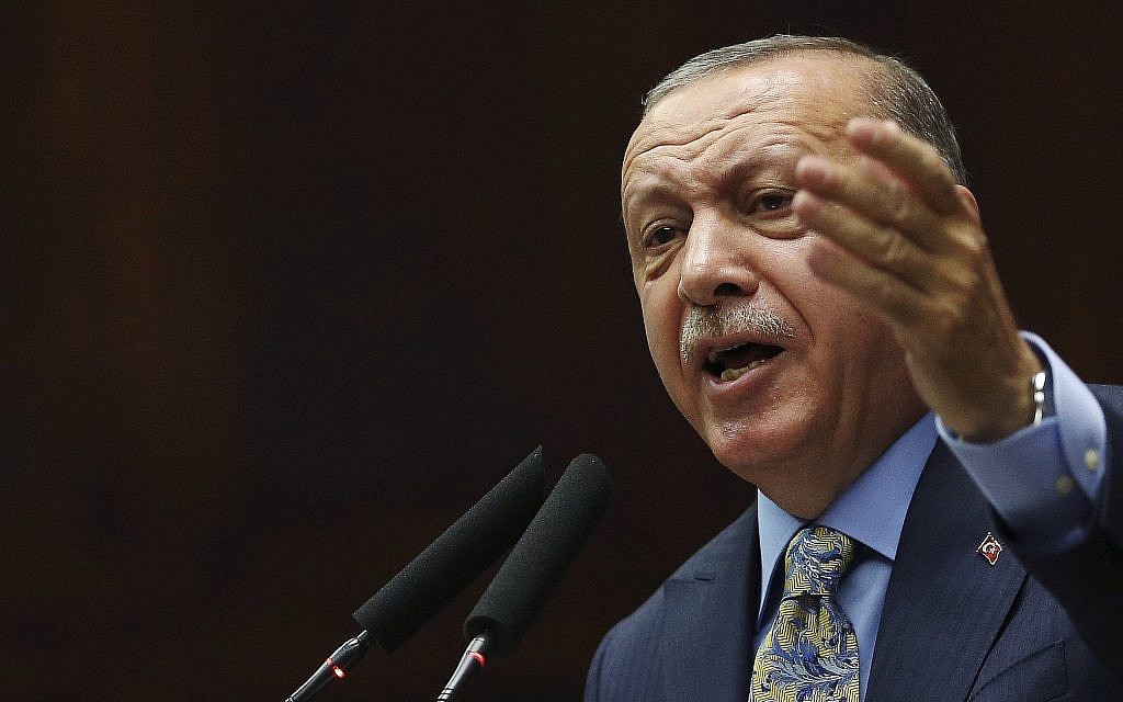 Turkey's President Recep Tayyip Erdogan gestures as he addresses members of his ruling Justice and Development Party (AKP), at the parliament in Ankara, Turkey, Tuesday, Oct. 23, 2018 (AP Photo/Ali Unal)