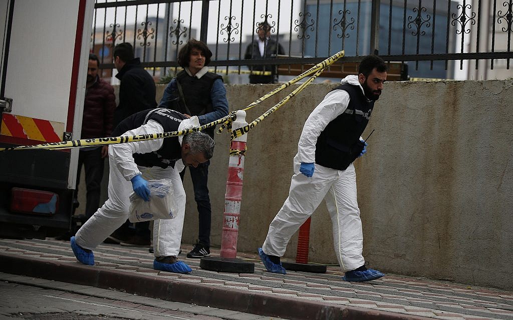 Turkish police crime scene investigators, looking for possible clues into the killing of Saudi journalist Jamal Khashoggi, walk toward an underground parking lot, where authorities had found a vehicle belonging to the Saudi consulate, in Istanbul, October 23, 2018. (AP/Emrah Gurel)