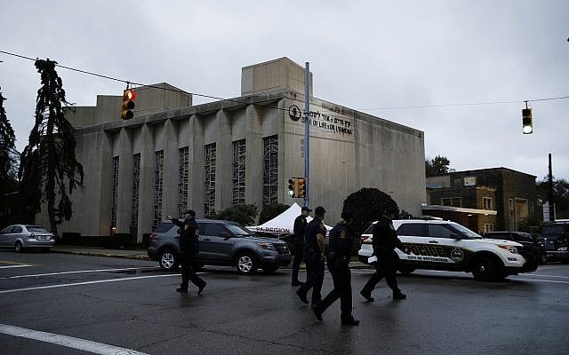Police officers walk outside the Tree of Life synagogue in the aftermath of a deadly shooting yesterday in Pittsburgh, October 28, 2018. (AP Photo/Matt Rourke) Police officers walk outside the Tree of Life synagogue in the aftermath of a deadly shooting yesterday in Pittsburgh, October 28, 2018. (AP Photo/Matt Rourke)
