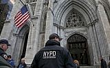NYPD counterterrorism officers are stationed at St. Patrick's Cathedral, as religious institutions boost security in the aftermath of Pittsburgh's Synagogue shooting, October 29, 2018, in New York. (AP Photo/Bebeto Matthews)