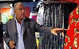 Sir Philip Green, a British billionaire and the CEO of the Arcadia Group, right, tours a Topshop store in central Hong Kong, June 5, 2013 (AP Photo/Kin Cheung)