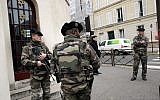 Illustrative: Soldiers stand guard outside a synagogue in Neuilly sur Seine, outside Paris, France, January 13, 2015. (AP /Christophe Ena)