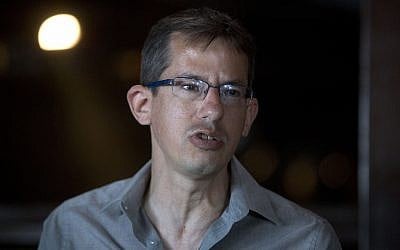 File: B'Tselem chief Hagai El-Ad speaks during a press conference in Tel Aviv, February 2016 (AP Photo/Sebastian Scheiner)