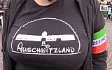 Screen capture from video Selene Ticchi, an activist with the Italian neo-fascist Forza Nuova movement, wears a t-shirt with the slogan 'Asuchwitzland' on it at a rally in the northeast town of Predappio, October 28, 2018. (YouTube)