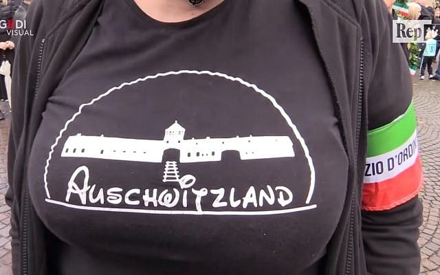 Screen capture from video Selene Ticchi, an activist with the Italian neo-fascist Forza Nuova movement, wears a t-shirt with the slogan 'Asuchwitzland' on it at a rally in the northeast town of Predappio, October 28, 2018. (YouTube) Screen capture from video Selene Ticchi, an activist with the Italian neo-fascist Forza Nuova movement, wears a t-shirt with the slogan 'Asuchwitzland' on it at a rally in the northeast town of Predappio, October 28, 2018. (YouTube)