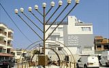 Illustrative: Construction workers build the frame of a World War II-era Quonset hut in front of the Jewish Community Center in Larnaca, Cyprus. (Larry Luxner/Times of Israel)