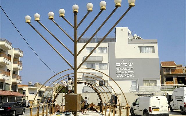 Illustrative: Construction workers build the frame of a World War II-era Quonset hut in front of the Jewish Community Center in Larnaca, Cyprus. (Larry Luxner/Times of Israel) Illustrative: Construction workers build the frame of a World War II-era Quonset hut in front of the Jewish Community Center in Larnaca, Cyprus. (Larry Luxner/Times of Israel)