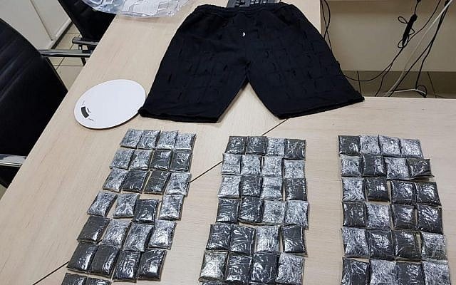 In this photo released by Israel Police on September 30, 2018, a pair of pants allegedly used to smuggle three kilograms of cocaine through Ben Gurion Airport and packages said to contain drug are seen. (Israel Police) In this photo released by Israel Police on September 30, 2018, a pair of pants allegedly used to smuggle three kilograms of cocaine through Ben Gurion Airport and packages said to contain drug are seen. (Israel Police)