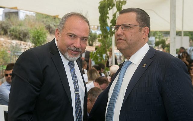 Defense Minister Avigdor Liberman (L) speaks with Moshe Lion (R) during a special cabinet meeting for Jerusalem day in Ein Lavan spring in Jerusalem on June 2, 2016. (Marc Israel Sellem/POOL) Defense Minister Avigdor Liberman (L) speaks with Moshe Lion (R) during a special cabinet meeting for Jerusalem day in Ein Lavan spring in Jerusalem on June 2, 2016. (Marc Israel Sellem/POOL)