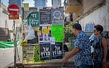 Campaign posters for the upcoming municipality elections in Tel Aviv, on October 9, 2018. (Miriam Alster/FLASH90)