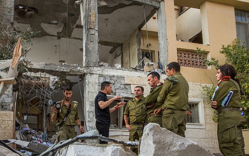 Illustrative: Maj. Gen. Herzi Halevi (C), the head of the IDF's Southern Command, visits a home in Beersheba that was destroyed by a rocket fired from the Gaza Strip on October 17, 2018. (Flash90)