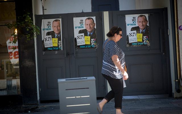 Campaign posters showing current mayor of Tel Aviv Ron Huldai, on the streets of Tel Aviv, prior to the upcoming municipality elections, on October 28, 2018. (Miriam Alster/FLASH90)