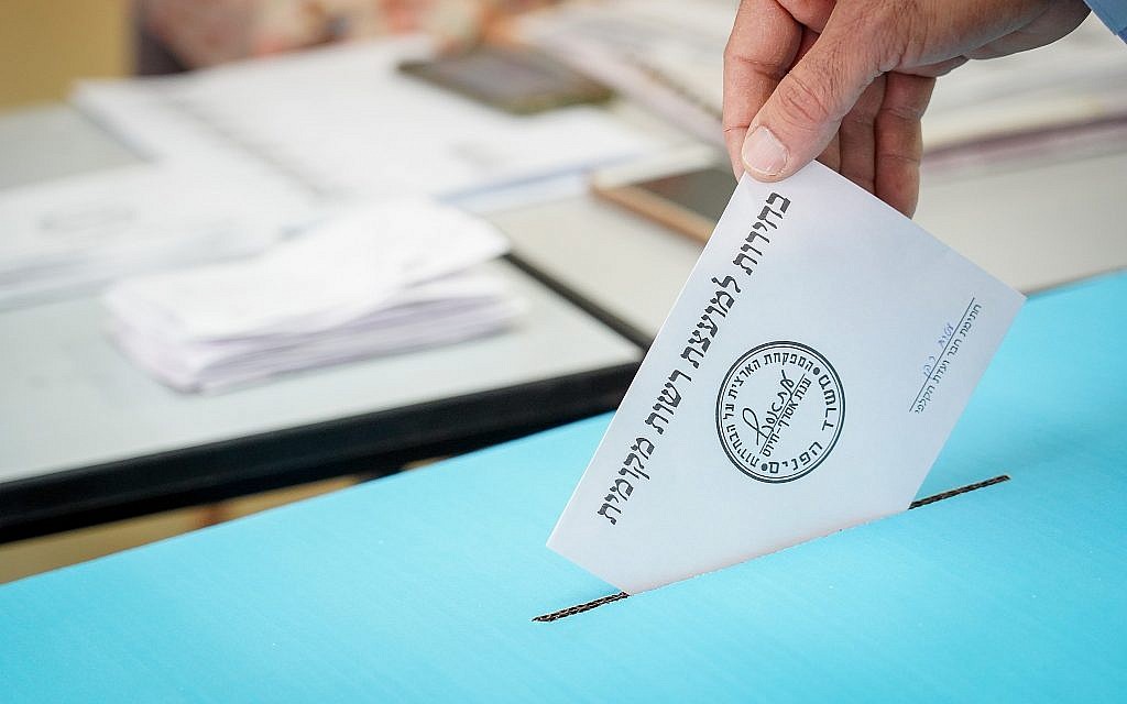 Illustrative - A man casts his ballot at a voting station on the morning of the Municipal Elections, on October 30, 2018, in Kedumim. (Hillel Maeir/Flash90)