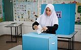 An Arab Israeli woman casts her ballot at a voting station during municipal elections, in Kafr Qasim, on October 30, 2018. Roy Alima/Flash90)