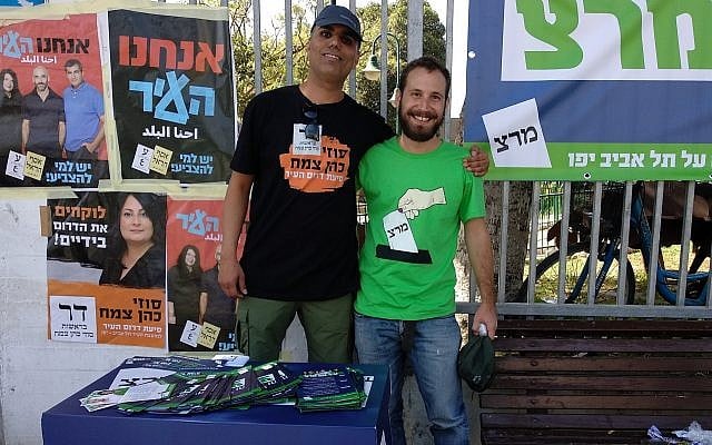 Sasi Ben Menachem, left, of Suzy Cohen-Zemach's South of the City party, and Nir Simon of Meretz shared a table outside a polling station in the Shapira neighborhood of Tel Aviv during local elections on October 30, 2018. (Melanie Lidman/Times of Israel) Sasi Ben Menachem, left, of Suzy Cohen-Zemach's South of the City party, and Nir Simon of Meretz shared a table outside a polling station in the Shapira neighborhood of Tel Aviv during local elections on October 30, 2018. (Melanie Lidman/Times of Israel)
