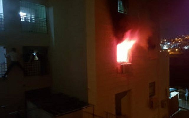 A fire in a Beitar Ilit apartment building on October 9, 2018 (Fire Services/ Shai Region)