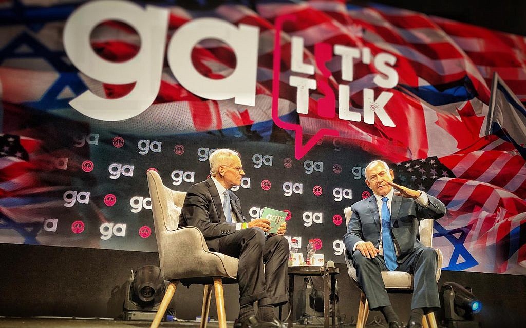 Prime Minister Benjamin Netanyahu (R) and and Richard Sandler, outgoing chairman of board of trustees for the Jewish Federation of North America, at the JFNA's General Assembly in Tel Aviv, on October 24, 2018. (JFNA/Eyal Warshovsky)