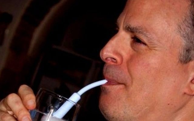 Man using the Zen Eating sipping device  (Courtesy)