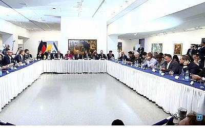 Screen capture from video of German Chancellor Angela Merkel, center, together with Prime Minister Benjamin Netanyahu at a meeting with Israeli innovators, at the Israeli Museum in Jerusalem, October 4, 2018. (YouTube)