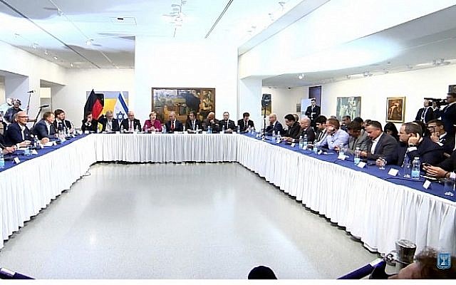 Screen capture from video of German Chancellor Angela Merkel, center, together with Prime Minister Benjamin Netanyahu at a meeting with Israeli innovators, at the Israeli Museum in Jerusalem, October 4, 2018. (YouTube) Screen capture from video of German Chancellor Angela Merkel, center, together with Prime Minister Benjamin Netanyahu at a meeting with Israeli innovators, at the Israeli Museum in Jerusalem, October 4, 2018. (YouTube)