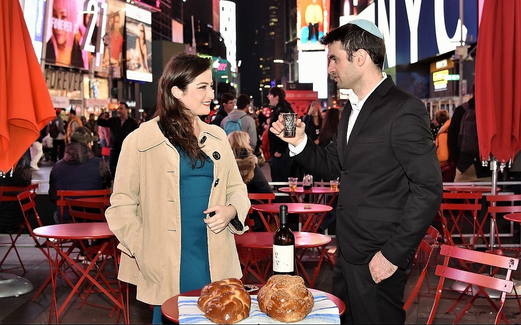 Adi Greenberger, left, and Nadav Freeman at a Shabbat Project event in New York's Times Square last year. (Ido Simantov/Courtesy)