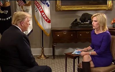 Screen capture from video of US President Donald Trump, left, during an interview with Laura Ingraham of Fox News, at the White House, Washington, October 29, 2018. (YouTube)