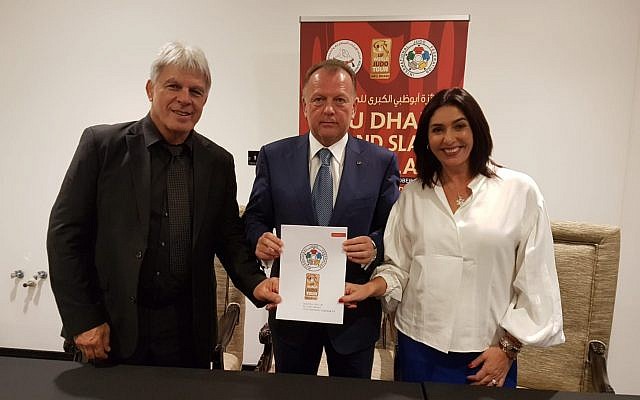 (L-R) Culture Minister Miri Regev, international Judo Federation president Marius Vizel and Israel Judo Association chairman Moshe Ponte sign an agreement for Israel to host a Grand Prix in 2018, October 28, 2018. (Guy Inbar) (L-R) Culture Minister Miri Regev, international Judo Federation president Marius Vizel and Israel Judo Association chairman Moshe Ponte sign an agreement for Israel to host a Grand Prix in 2018, October 28, 2018. (Guy Inbar)