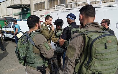 Israeli security forces at the scene of a fatal shooting attack in Barkan Industrial Park in the northern West Bank on October 7, 2018. (Israel Defense Forces)