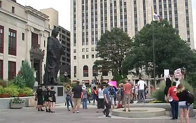Demonstrators protest against a statue of Christopher Columbus, in Columbus, Ohio, on August 22, 2017. (Screen capture; YouTube)