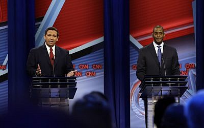 Florida Republican gubernatorial candidate Ron DeSantis, left, speaks about his Democratic opponent Andrew Gillum during a CNN debate, Sunday, Oct. 21, 2018, in Tampa, Florida (Photo by Chris O'Meara-Pool/Getty Images via JTA)