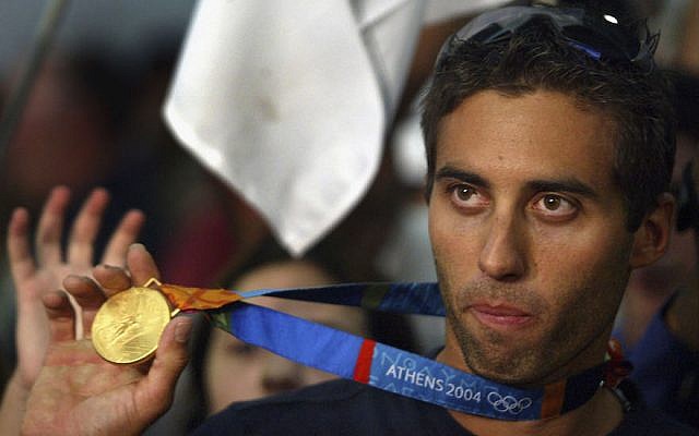 Israel’s only Olympic gold medalist Gal Fridman celebrate as he arrives home in Ben Gurion Airport in Tel Aviv, Aug. 30, 2004. (Uriel Sinai/Getty Images via JTA)