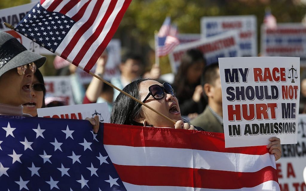 A demonstrator participates in a rally in Boston’s Copley Square in support of a lawsuit against Harvard contending that the university discriminates against Asian Americans in admissions, October 14, 2018. (Jessica Rinaldi/The Boston Globe via Getty Images/via JTA)