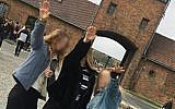 Image posted to Instagram and later deleted showing three youngsters performing a salute at Auschwitz, October 2018 (via Instagram)