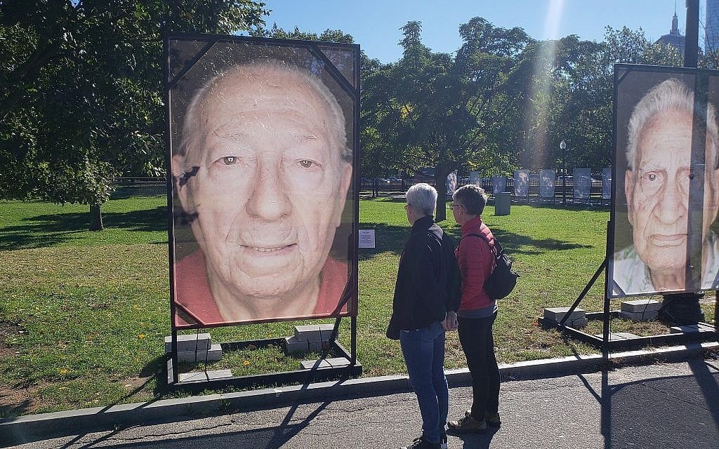 Staged in Boston Common, the 'Lest We Forget' Holocaust remembrance installation includes a photograph of survivor Israel 'Izzy' Arbeiter, Boston, Massachusetts, October 16, 2018 (Matt Lebovic/The Times of Israel)