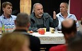 Defense Minister Avigdor Liberman speaks to residents of the Gaza periphery in Kibbutz Kerem Shalom on October 26, 2018. (Ariel Hermoni/Defense Ministry)