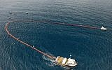 SodaStream's "Holy Turtle," a 300-meter (1,000-foot) device the company says can clean plastic garbage from the ocean without harming marine life, seen deployed in a cleanup operation in Honduras. (Courtesy SodaStream International/PRNewsfoto)