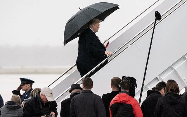 President Donald Trump boards Air Force One at Andrews Air Force Base in Maryland after speaking to reporters about the fatal shooting at the Tree of Life Synagogue in Pittsburgh, Oct. 27, 2018. (Ken Cedeno/Pool/Getty Images)