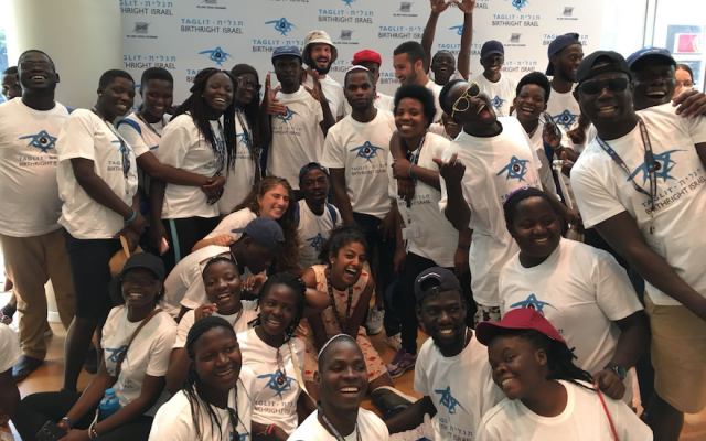 In September 2018, members of the Ugandan Jewish community participated in its first Birthright trip. Asiimwe Rabbin is in the foreground, center. (Birthright Israel via JTA) In September 2018, members of the Ugandan Jewish community participated in its first Birthright trip. Asiimwe Rabbin is in the foreground, center. (Birthright Israel via JTA)