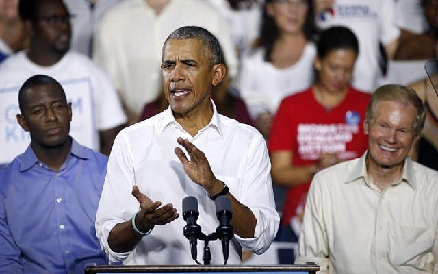 Florida Democratic gubernatorial nominee Andrew Gillum, left, and Senator Bill Nelson (D-Florida) listen to former president Barack Obama as he addresses the media and supporters as they stump for votes at a rally in Miami, Florida, November 2, 2018. (Rhona Wise/AFP) Florida Democratic gubernatorial nominee Andrew Gillum, left, and Senator Bill Nelson (D-Florida) listen to former president Barack Obama as he addresses the media and supporters as they stump for votes at a rally in Miami, Florida, November 2, 2018. (Rhona Wise/AFP)