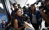Democratic congressional candidate Alexandria Ocasio-Cortez, left, speaks with  reporters after her general campaign kick-off rally in the Bronx borough of New York, September 22, 2018. (Don EMMERT/AFP)