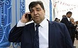 In this file photo taken on May 02, 2018, Rene Trabelsi speaks on the phone outside the Ghriba Synagogue on the Tunisian resort island of Djerba. (FETHI BELAID / AFP)