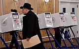A voter casts his ballot at the East Midwood Jewish Center polling station in the Brooklyn borough of New York City on November 6, 2018. (Angela Weiss / AFP)