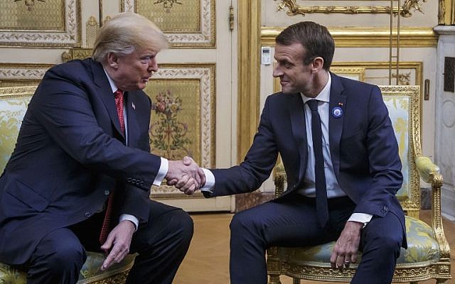 US President Donald Trump (L) shakes hands with French President Emmanuel Macron prior to their meeting at the Elysee Palace in Paris, on November 10, 2018. (Christophe Petit-Tesson/Pool/AFP) US President Donald Trump (L) shakes hands with French President Emmanuel Macron prior to their meeting at the Elysee Palace in Paris, on November 10, 2018. (Christophe Petit-Tesson/Pool/AFP)