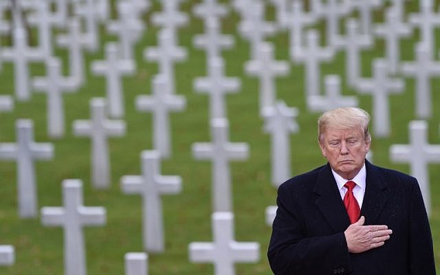 US President Donald Trump takes part in a ceremony at the American Cemetery of Suresnes, outside Paris, on November 11, 2018 as part of Veterans Day and commemorations marking the 100th anniversary of the 11 November 1918 armistice, ending World War I. (SAUL LOEB / AFP) US President Donald Trump takes part in a ceremony at the American Cemetery of Suresnes, outside Paris, on November 11, 2018 as part of Veterans Day and commemorations marking the 100th anniversary of the 11 November 1918 armistice, ending World War I. (SAUL LOEB / AFP)