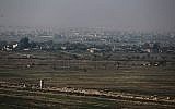 Illustrative: A picture taken on November 12, 2018, from al-Qaim in Iraq's border al-Anbar province shows the Syrian border city of Abu Kamal in the Deir Ezzor region. (AHMAD AL-RUBAYE / AFP)