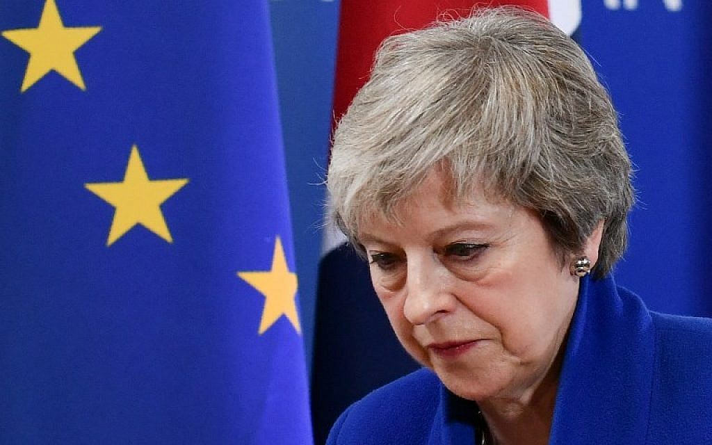 Britain's Prime Minister Theresa May leaves after a press conference following a special meeting of the European Council to endorse the draft Brexit withdrawal agreement and to approve the draft political declaration on future EU-UK relations on November 25, 2018 in Brussels. (Photo by Philippe LOPEZ / AFP) Britain's Prime Minister Theresa May leaves after a press conference following a special meeting of the European Council to endorse the draft Brexit withdrawal agreement and to approve the draft political declaration on future EU-UK relations on November 25, 2018 in Brussels. (Photo by Philippe LOPEZ / AFP)
