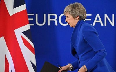 Britain's Prime Minister Theresa May leaves after a press conference following a special meeting of the European Council to endorse the draft Brexit withdrawal agreement on November 25, 2018 in Brussels. (Emmanuel Dunand/AFP)