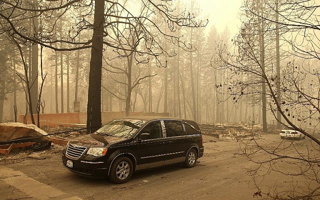 A hearse carries the remains of two deceased victims of the Camp Fire on November 10, 2018 in Paradise, California. (Justin Sullivan/Getty Images/AFP) A hearse carries the remains of two deceased victims of the Camp Fire on November 10, 2018 in Paradise, California. (Justin Sullivan/Getty Images/AFP)