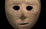 A 9,000-year-old stone mask discovered in the South Hebron Hills area of the West Bank in early 2018. (Clara Amit, Israel Antiquities Authority)